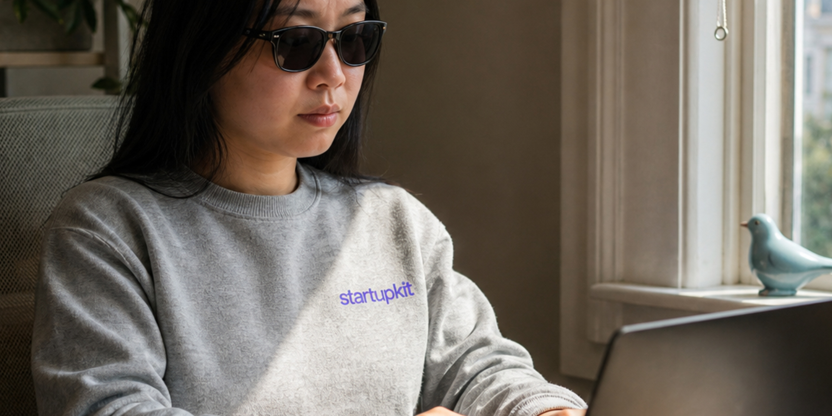 Blind candidate navigating a clean online job application by keyboard with a bright focus ring around the résumé upload button